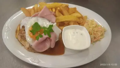 a plate of food with a sandwich and french fries at Malá Svatá Hora - penzion & restaurace in Mníšek pod Brdy