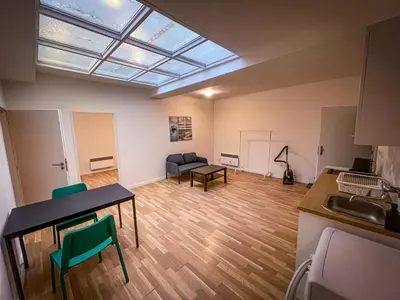 a large room with a table and chairs and a couch at Dittrichova Apartment in Prague