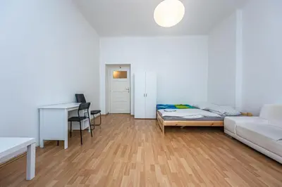a living room with a couch and a desk at Dittrichova Apartment in Prague