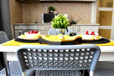 a kitchen with a table with two plates of food on it at Romantic Bijou Apartment near Old Town! in Prague