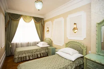 a bedroom with two beds and a window at Art Apartments Celakovskeho Sady in Prague
