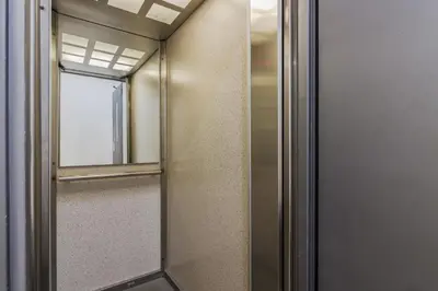 a glass door with a mirror in a room at Old Town Studio Apartment in Prague