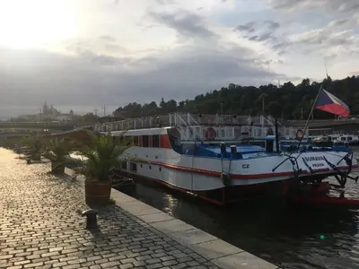 a large boat is docked in the water at Old Town Studio Apartment in Prague
