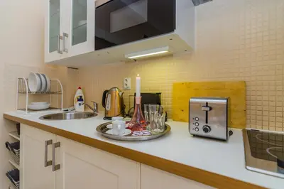 a kitchen with a counter with a sink and a counter sidx sidx at Old Town Studio Apartment in Prague