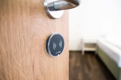 a close up of a wooden door with a knob at Hostel Mandarinka in Prague