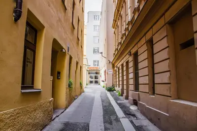 an alleyway between two buildings in a city at Hostel Mandarinka in Prague