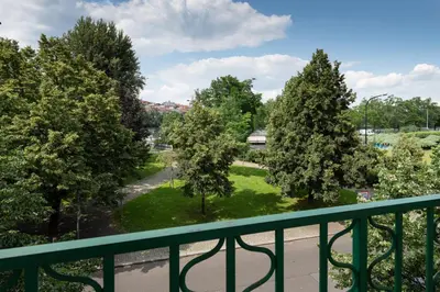 a view of a park from a balcony at Luxury apartment in prime location in Prague