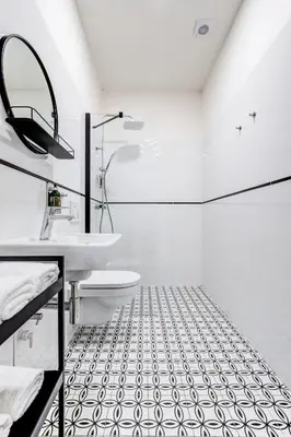 a white bathroom with a sink and a toilet at Design Pension Twenty 20 in Poděbrady