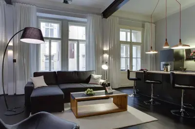 a living room with a couch and a table at BRIGHT Prague Havelská in Prague