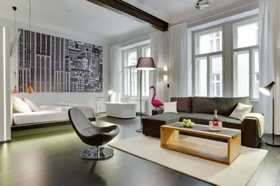 a living room with a couch and a table at BRIGHT Prague Havelská in Prague