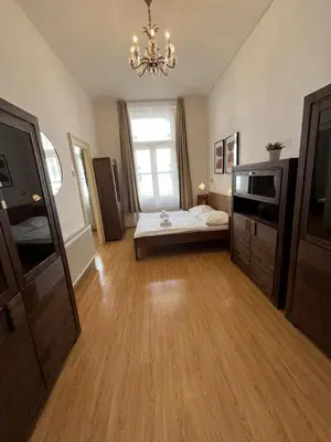 a large room with a bed and a window at Kaprova - Old Town Apartments in Prague