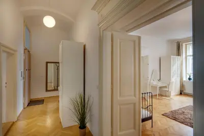 a hallway with a white refrigerator in a room at Kaprova - Old Town Apartments in Prague