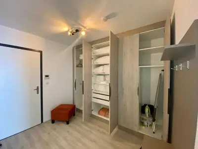 a room with a walk in closet with glass doors at Seven days Smíchov in Prague