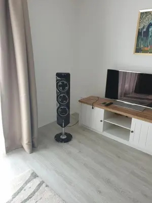 a speaker in a room next to a desk at Seven days Smíchov in Prague
