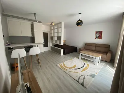 a living room with a couch and a table at Seven days Smíchov in Prague