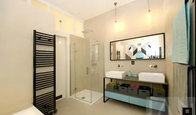 a bathroom with a shower and a sink and a mirror at Cubistic Residence Eliska / Jewish Quarter / Old Town in Prague