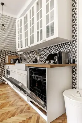 a kitchen with white cabinets and a dishwasher at Cubistic Residence Eliska / Jewish Quarter / Old Town in Prague