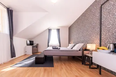 a bedroom with a bed in a room at Penzion Stříbrná Lhota in Mníšek pod Brdy