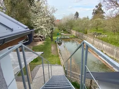 a balcony with a view of a canal at Apartmány Svatá in Svatá