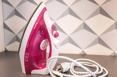 a pink and white phone sitting on a table at Design Studio Anděl, All Historical Sights Walkable in Prague