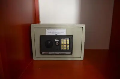 a small microwave oven sitting on top of a table at Fano Apartments Old Town Prague in Prague