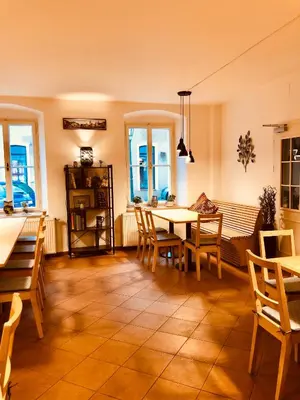 a kitchen and dining room with a table and chairs at Penzion Laterna in Litoměřice