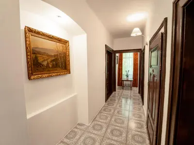 a hallway with a painting on the wall at Mlýn Davídkov in Hryzely