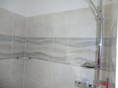 a shower in a bathroom with a shower curtain at Orbis in Prague