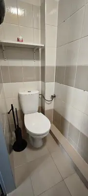 a bathroom with a white toilet in a room at Orbis in Prague
