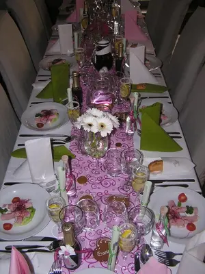 a long table with plates and glasses on it at Hotel U Lípy in Krušovice