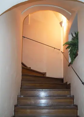 a set of stairs with an archway at Karlova - Old Town Apartment in Prague