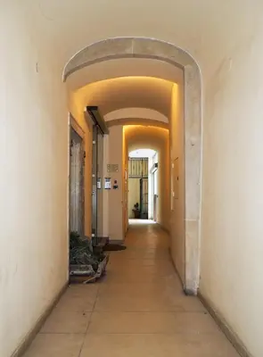 an empty hallway with an archway in a building at Karlova - Old Town Apartment in Prague
