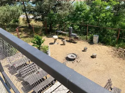 a garden with a grill and a fence at KuK Račice in Račice