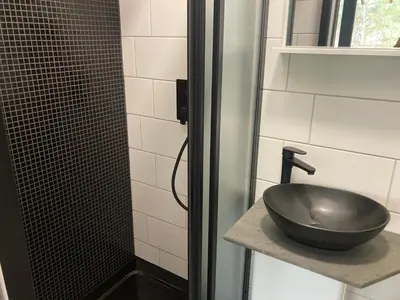 a bathroom with a sink and a shower at KuK Račice - pokoj s malou terasou in Račice