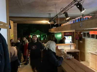 a group of people walking around a bar at KuK Račice - pokoj s malou terasou in Račice