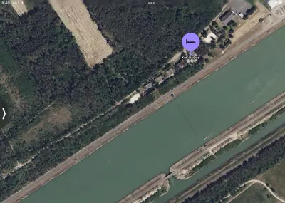 an overhead view of a house next to a river at KuK Račice - pokoj s malou terasou in Račice