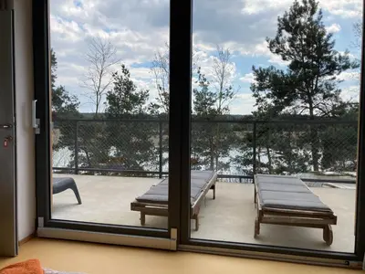 a view of a patio through a sliding glass door at KuK Račice - 4 loznice in Račice