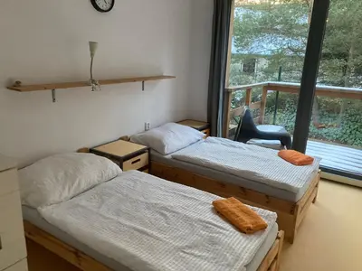 two twin beds in a room with a window at KuK Račice - 4 loznice in Račice