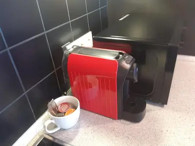 a toaster oven sitting on a counter in a kitchen at Apartment Park Radouč - 60m2 in Mladá Boleslav