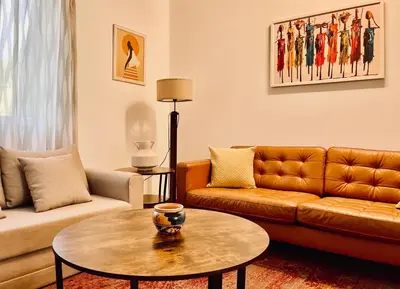 a living room with a couch and a table at Penzion Kokorin Forest Villa in Konrádov