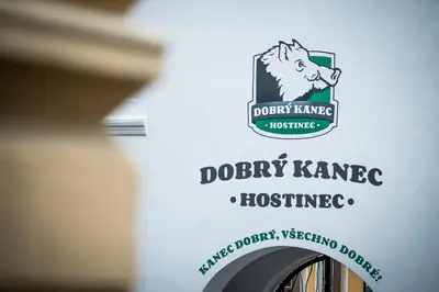 a bottle of wine with a dog logo on it at Dobrý Kanec - Hostinec in Mělník