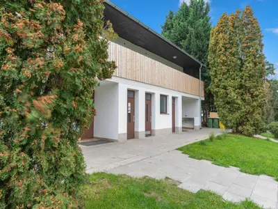 a building with a courtyard and trees in front of it at Holiday Home Prima Plus by Interhome in Prague