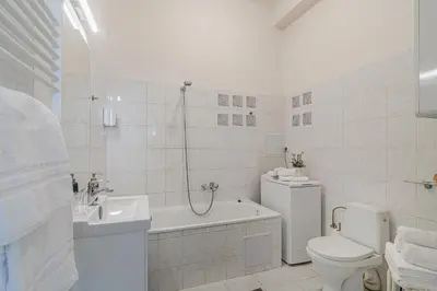 a white bathroom with a toilet and a sink at APT in center Prague by Michal&Friends in Prague