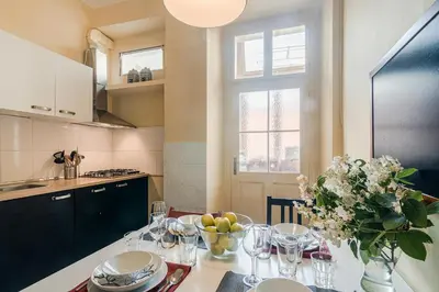 a kitchen with a table with a bowl of fruit on it at APT in center Prague by Michal&Friends in Prague
