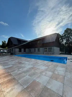 a house with a pool in front of it at Ranch Jestřebice in Heřmaničky