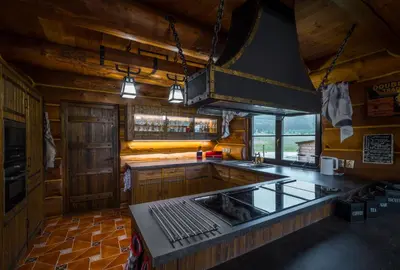 a kitchen with a sink and a stove top oven at Ranch Jestřebice in Heřmaničky