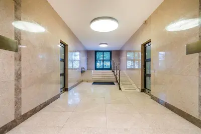 a hallway with doors and stairs in a building at APT IN CENTER Prague Great view by Michal&Friends in Prague