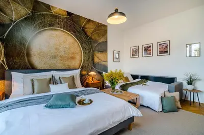 a bedroom with two beds and a large wall at APT IN CENTER Prague Great view by Michal&Friends in Prague