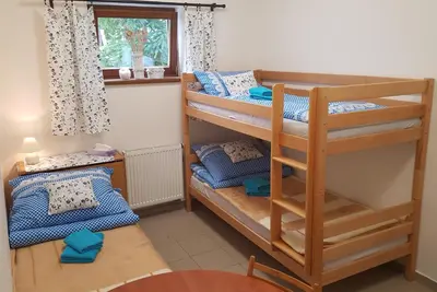 a room with two bunk beds and a window at Na samotě u lesa -Rasovna in Mšecké Žehrovice