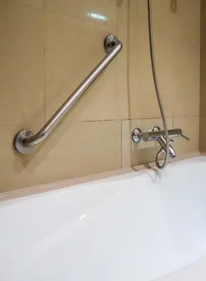 a grab bar in a shower in a bathroom at Žatecká - Old Town Residence in Prague